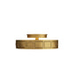 Gold circular decorative object with geometric patterns on a white background