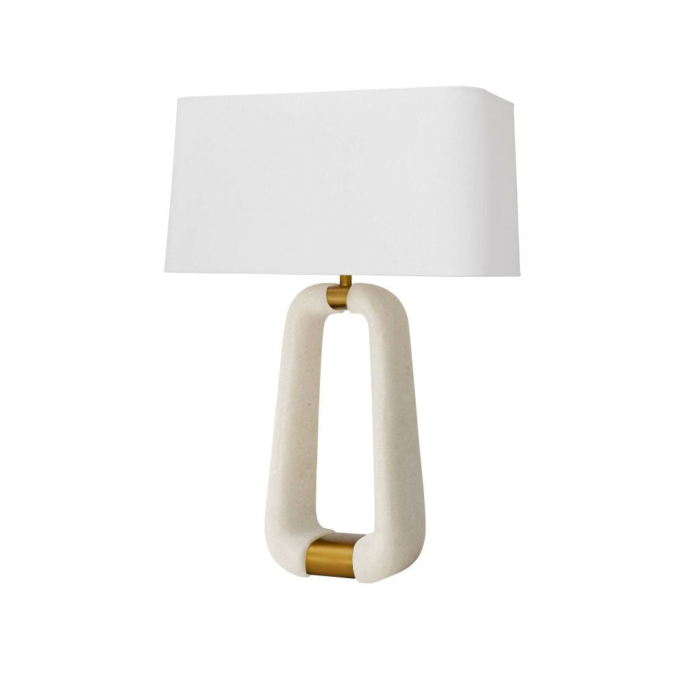 Table lamp with a white shade and gold accents on a white background
