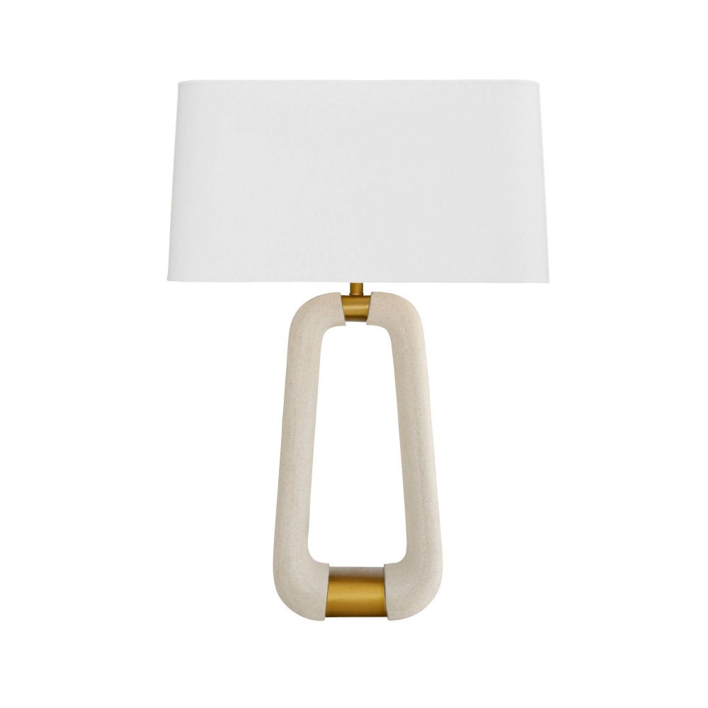 Table lamp with a white shade and gold base on a white background