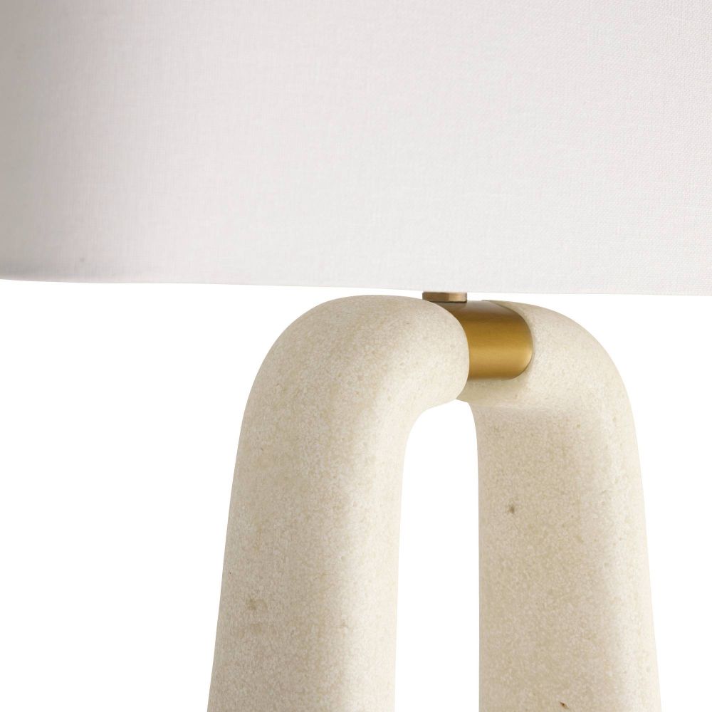 Beige ceramic table lamp with a gold accent on a white background