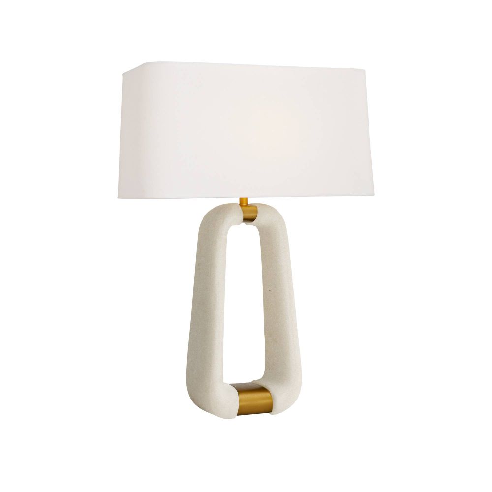 Table lamp with a white shade and gold accents on a white background