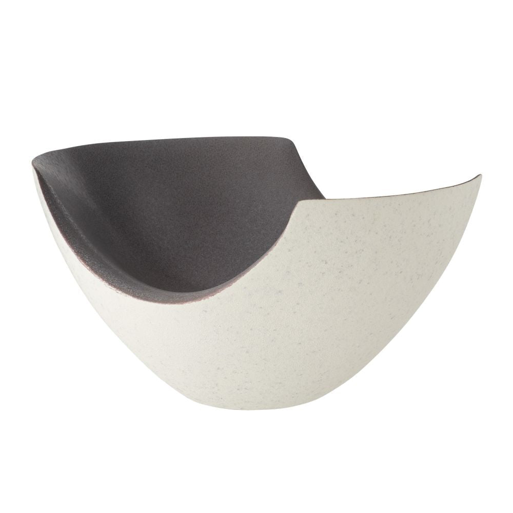Semicircular ceramic dish with black top and white bottom on a white background
