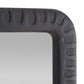 Close-up of a textured black mirror frame on a white background