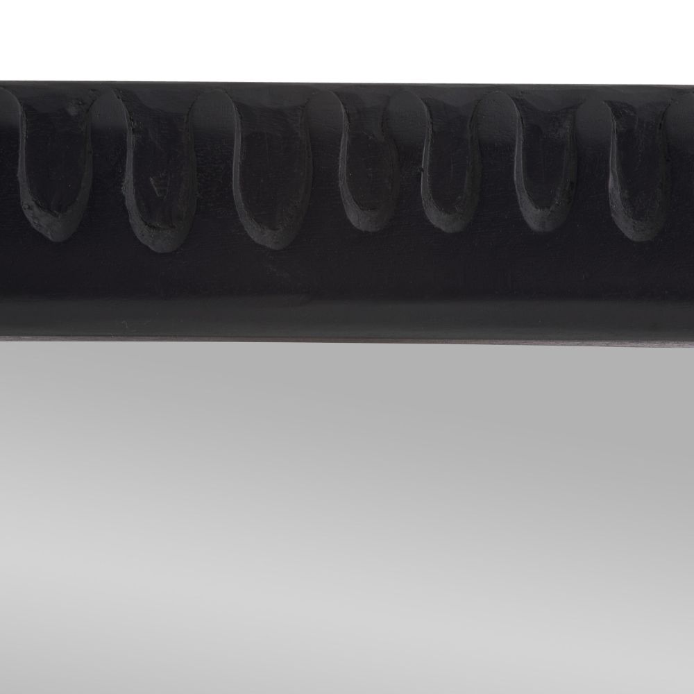 Close-up of a black metal spring on a white background