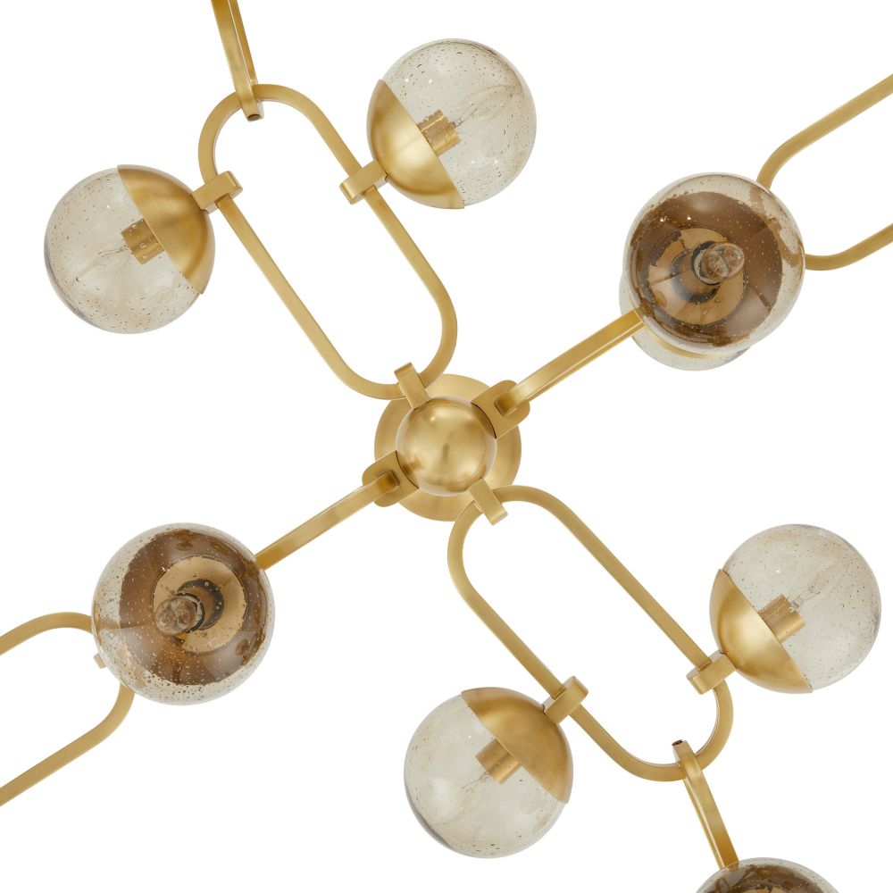Gold chandelier with spherical lampshades on a white background