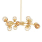 Gold chandelier with multiple spherical bulbs on a white background