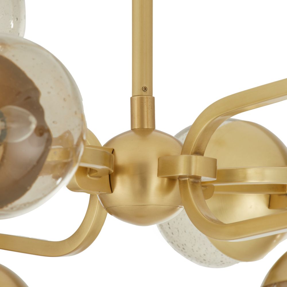 Gold chandelier with spherical design on a white background