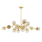 Gold chandelier with multiple spherical lights on a white background