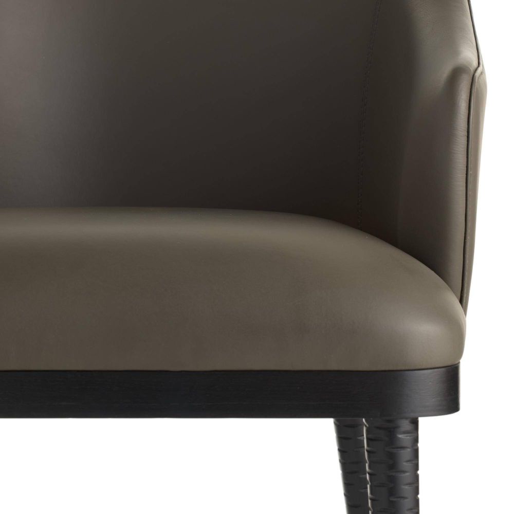 Gray leather armchair with black legs on a white background