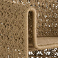 Close-up of a woven rattan chair with intricate patterns.