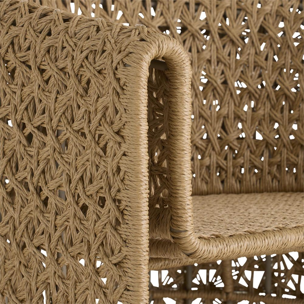 Close-up of a woven rattan chair with intricate patterns.