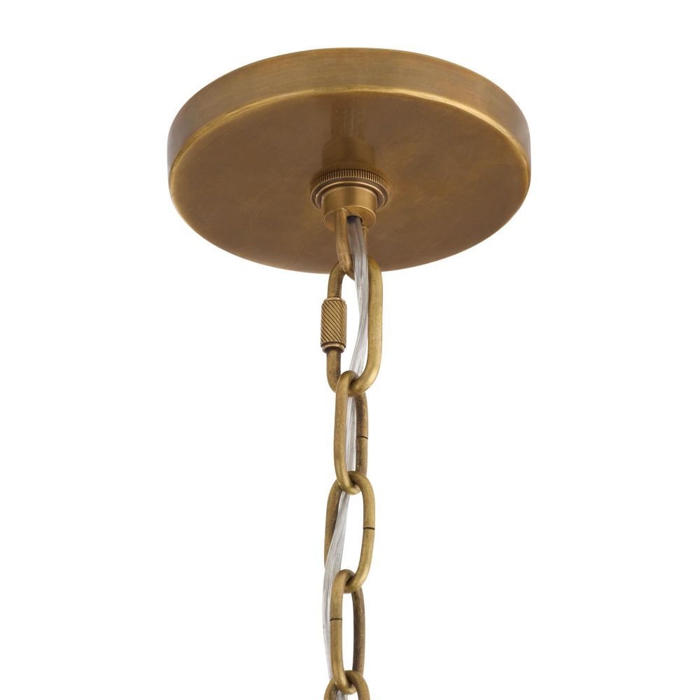 Brass ceiling light fixture with chain on a white background