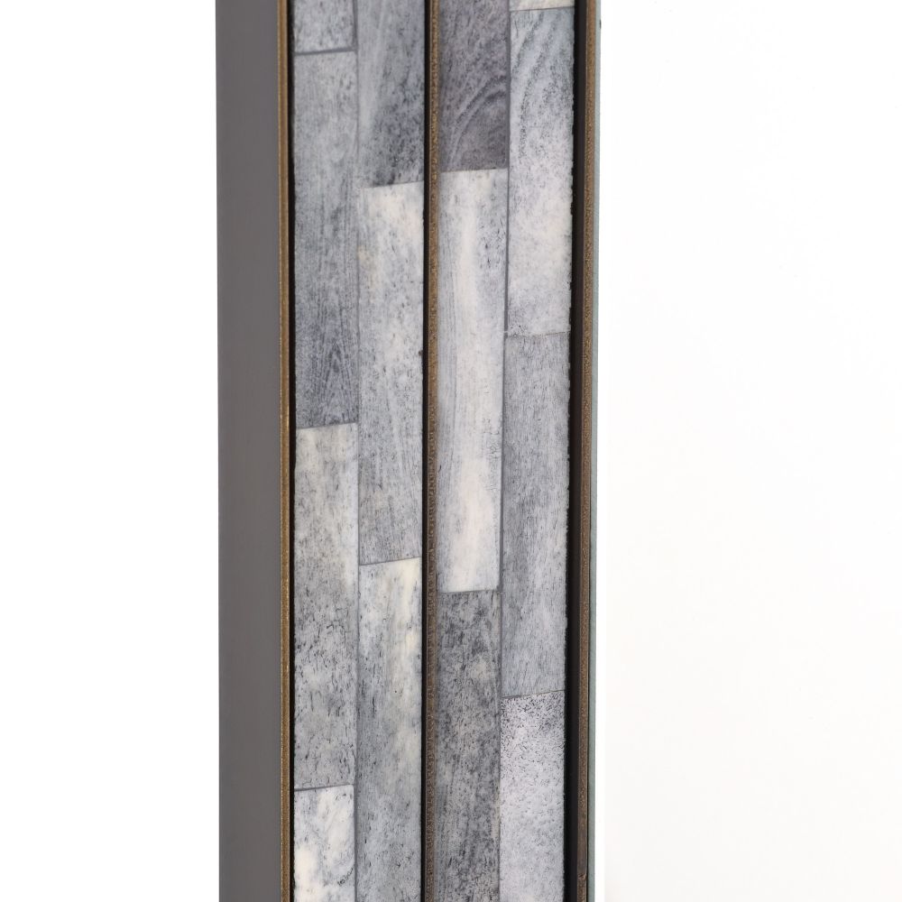 Decorative wall art with a patchwork design in neutral colors on a white background