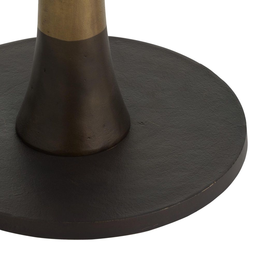 Close-up of a black round base with a gold accent on a white background