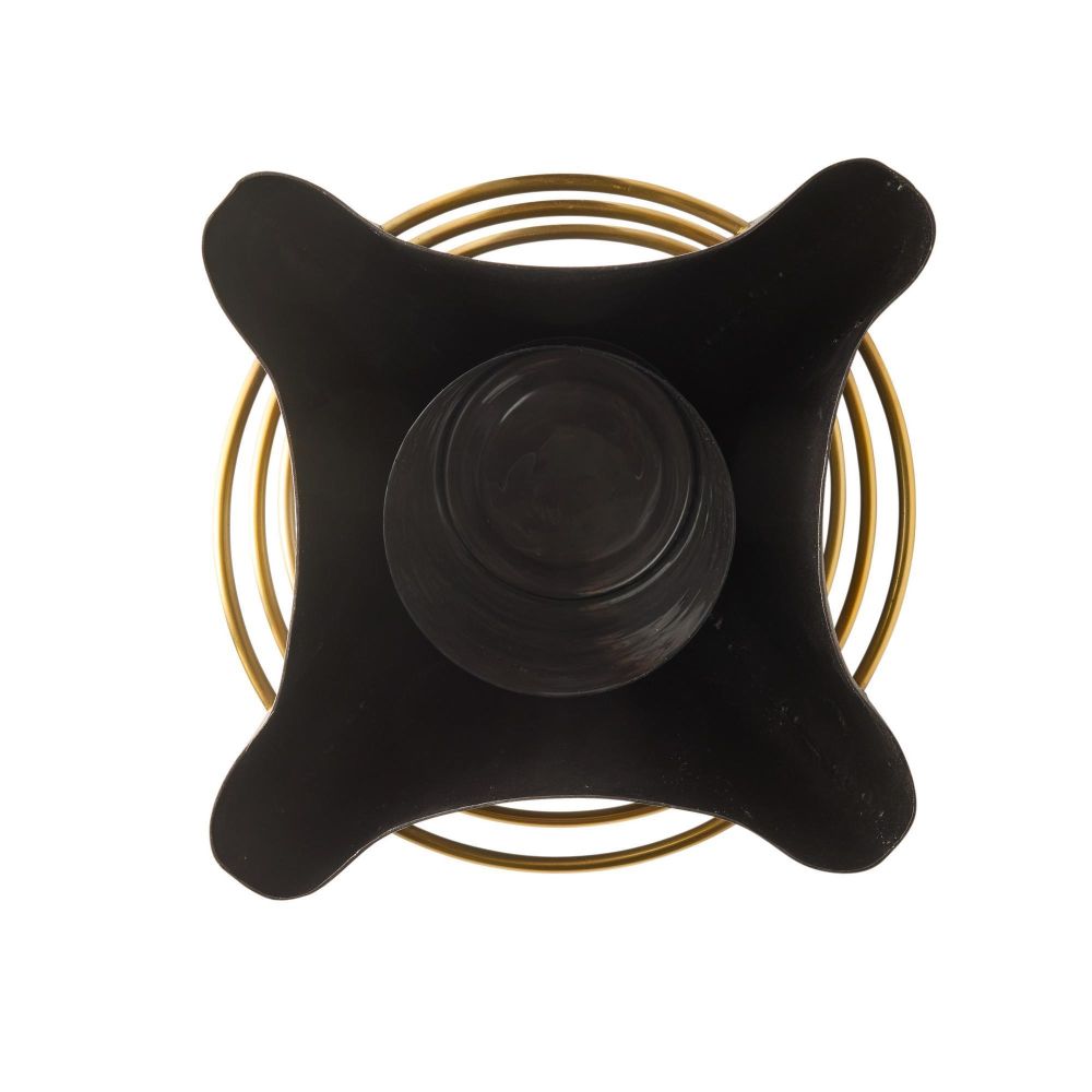 Black star-shaped object with a central circular component on a white background