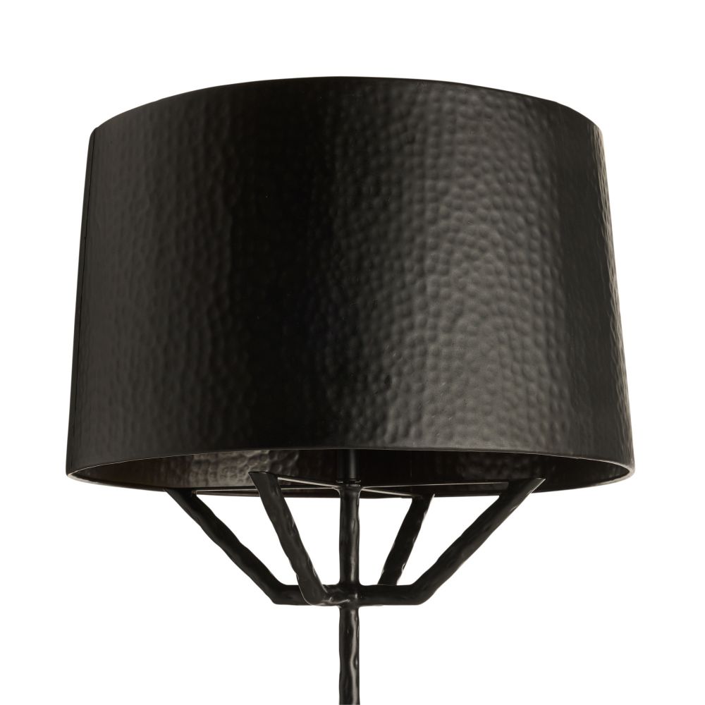 Black floor lamp with a textured shade on a white background