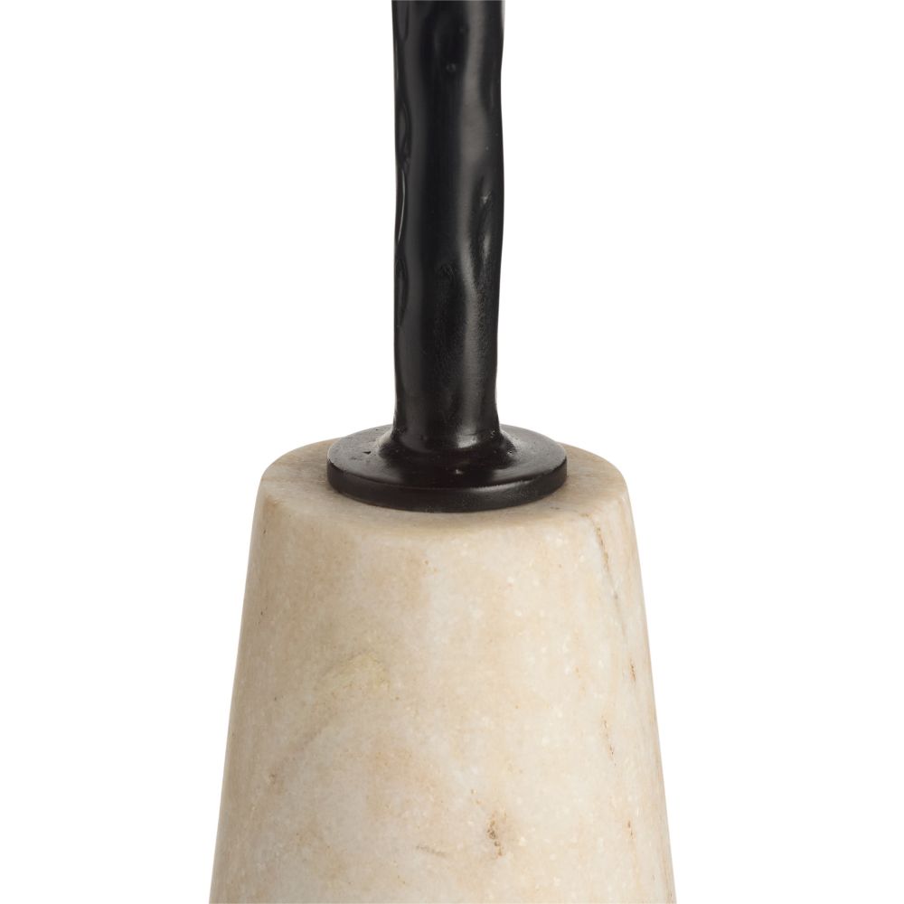 Decorative object with black cylindrical top and beige stone base on a white background