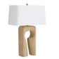 Table lamp with a beige base and white shade on a white background