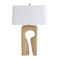 Table lamp with a beige base and white shade on a white background
