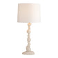 White table lamp with a textured base on a white background