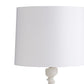 White lamp with a round shade on a white background