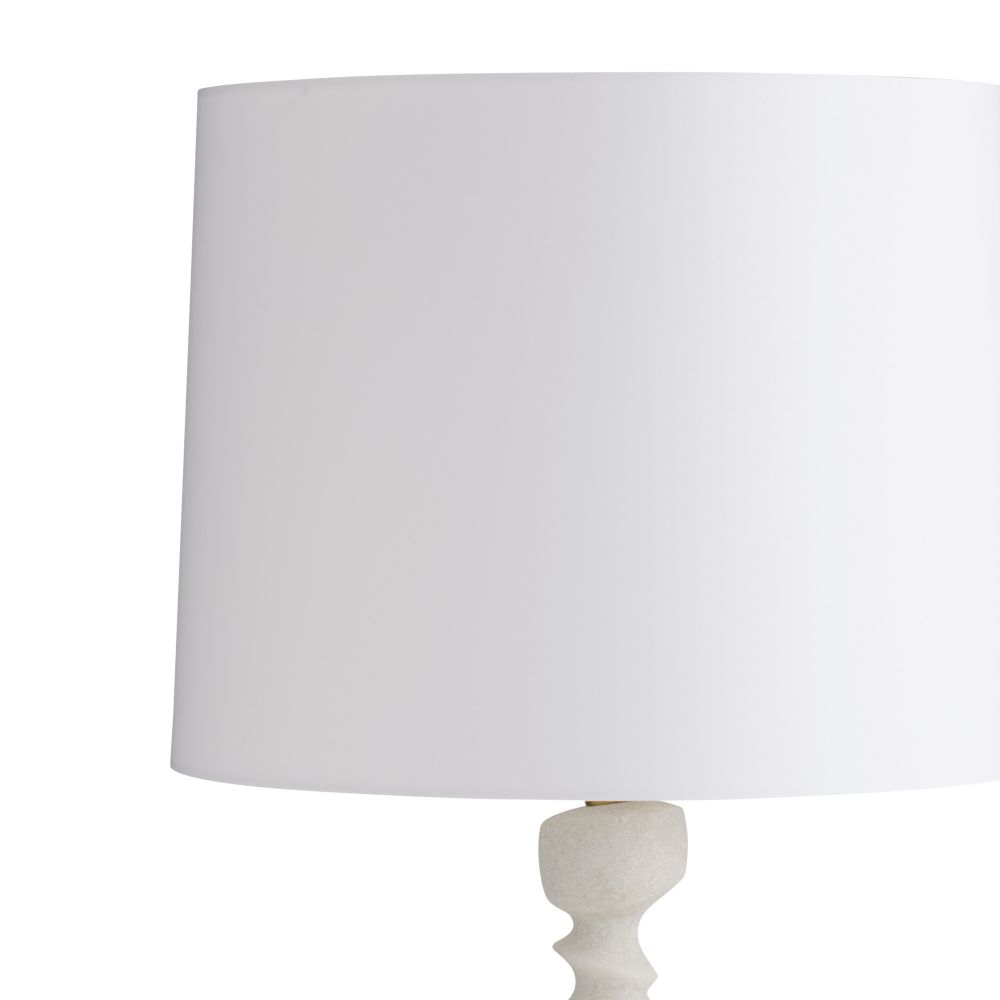 White lamp with a round shade on a white background