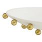 White dish with gold spherical accents on a white background