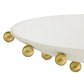 White chair with gold spherical legs on a white background