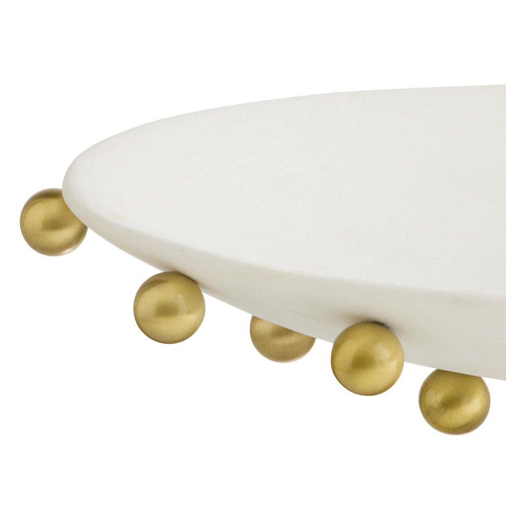 White chair with gold spherical legs on a white background
