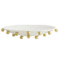 White dish with gold embellishments on a white background