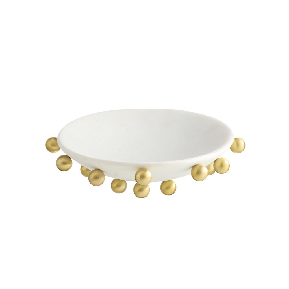 White plate with gold beads on a white background