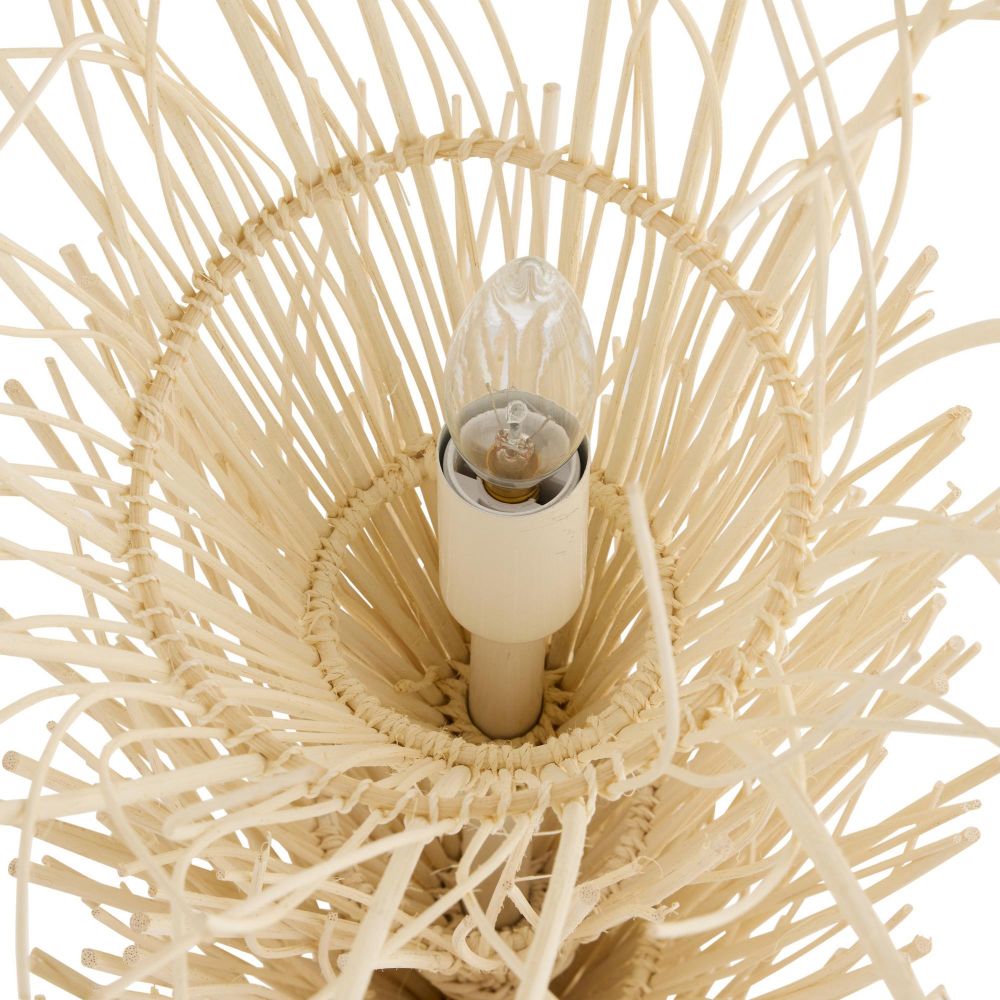 Close-up of a woven light fixture with a bulb inside on a white background