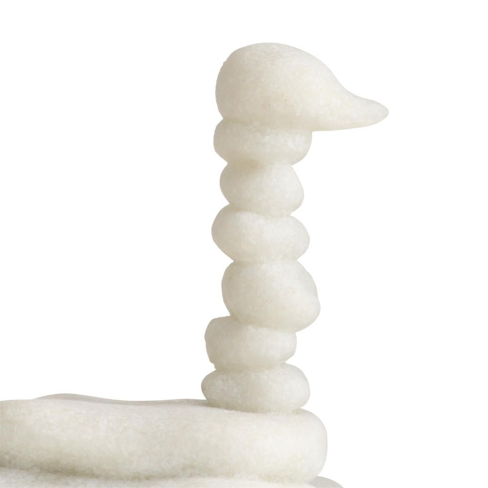 White marble sculpture of a bird on a white background
