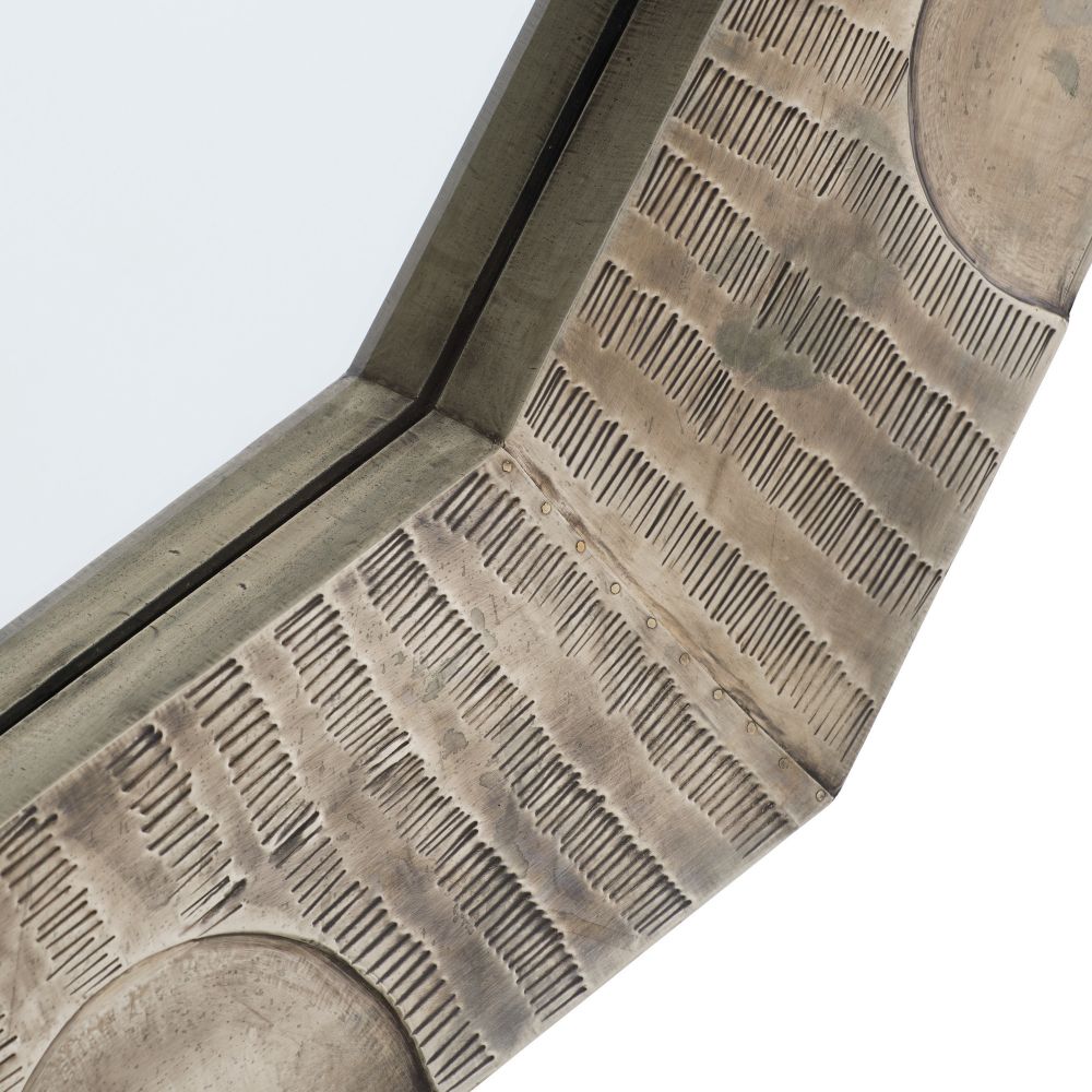 Close-up of a textured surface with geometric patterns on a light gray background