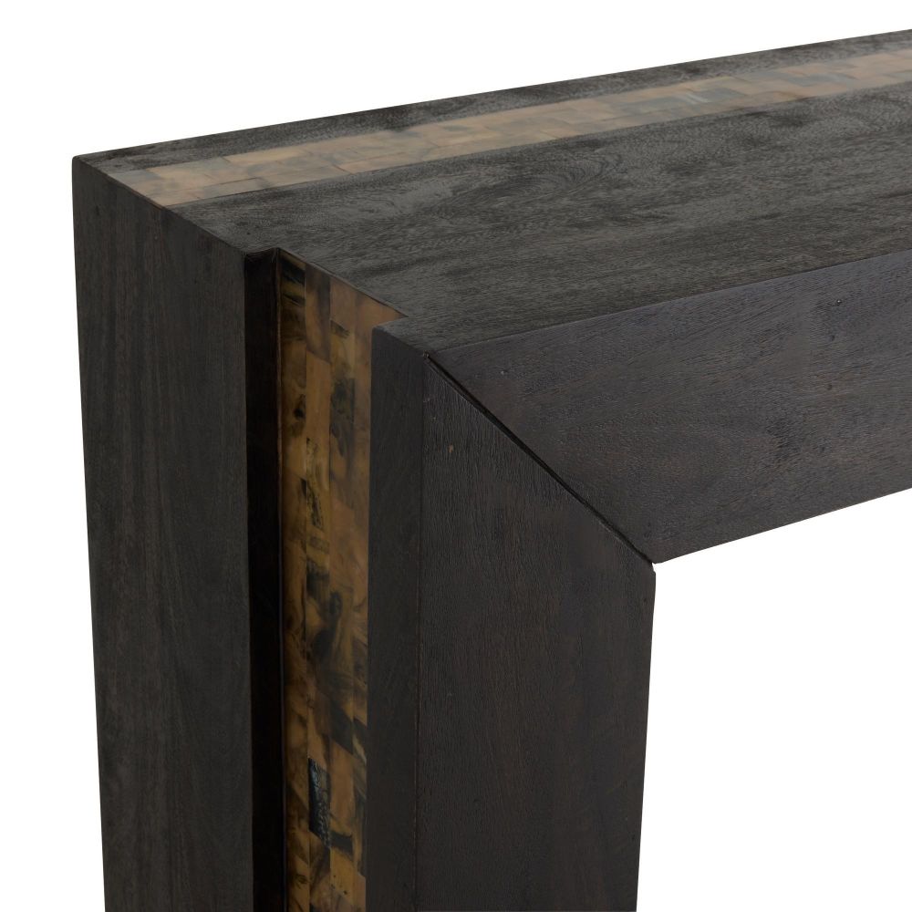 Close-up of a dark wooden console table corner with a white background