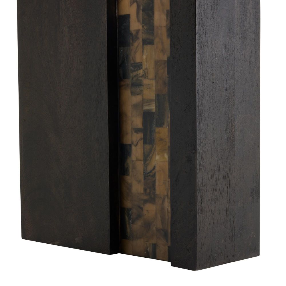 Close-up of a dark wooden book with a decorative spine on a white background