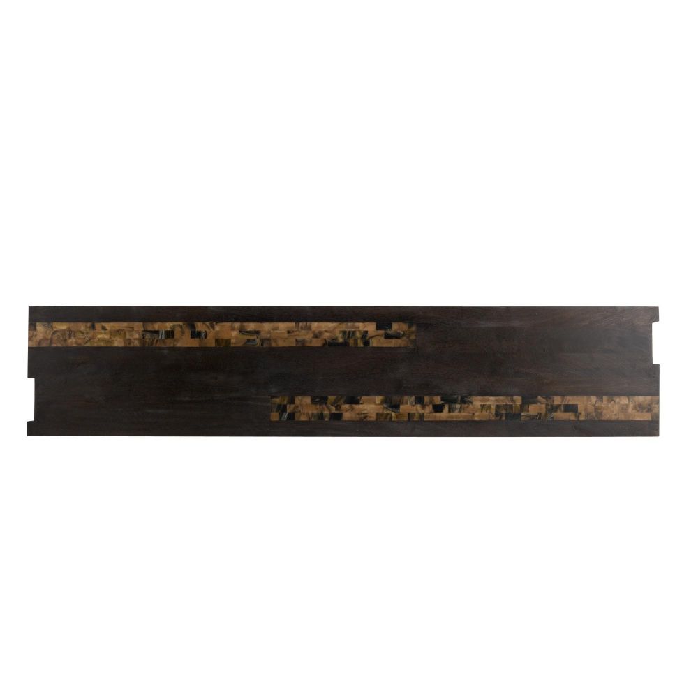 Dark wooden shelf with decorative patterns on a white background