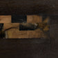 Close-up of a dark brown leather texture with a patterned border