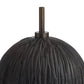 Close-up of a textured black object with a central rod on a white background