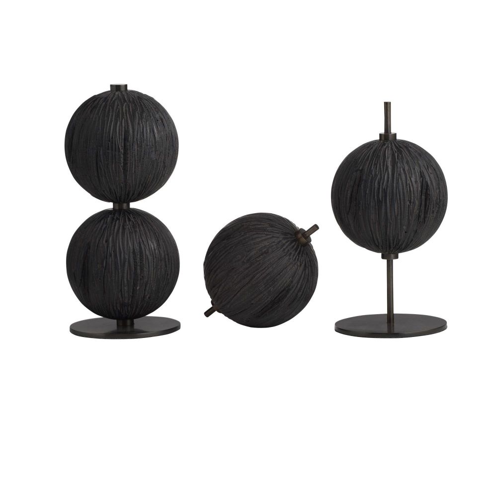 Set of black spherical decorative objects on stands against a white background