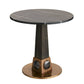 Round marble table with a unique base design on a white background