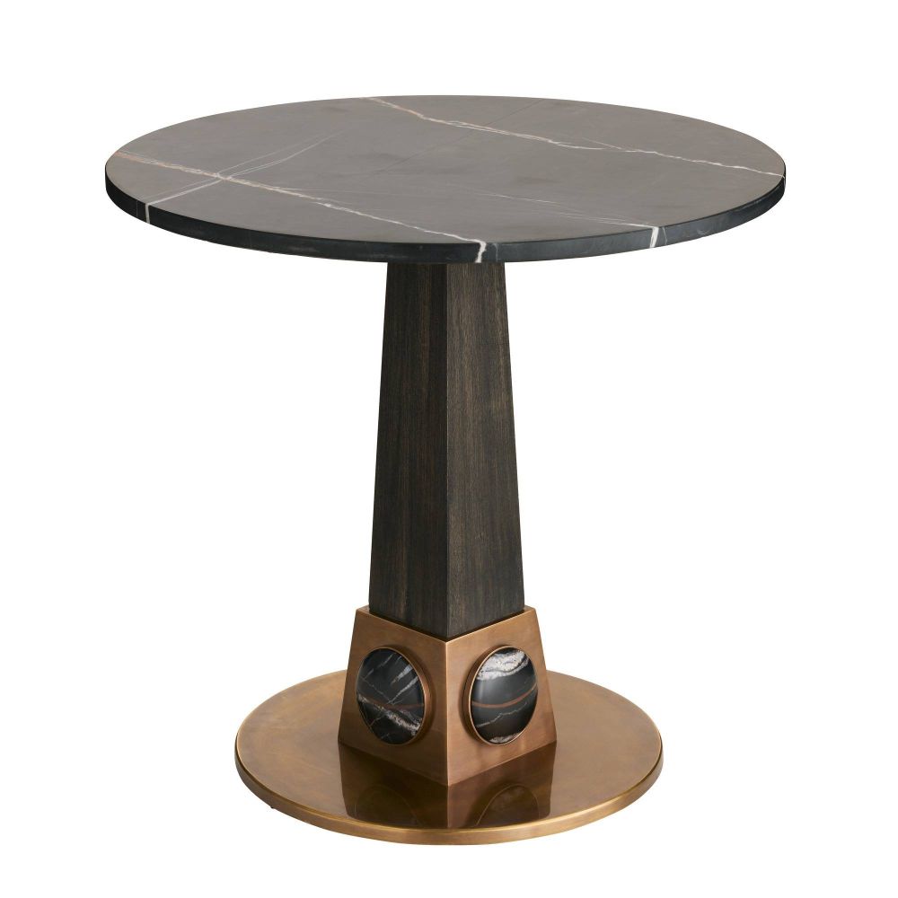 Round marble table with a unique base design on a white background