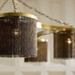 Chandelier with gold frame and black fringe design on a blurred background
