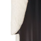 Close-up of a textured white and black sconce