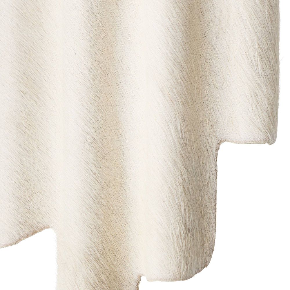 Close-up of a white hide sconce on a white background
