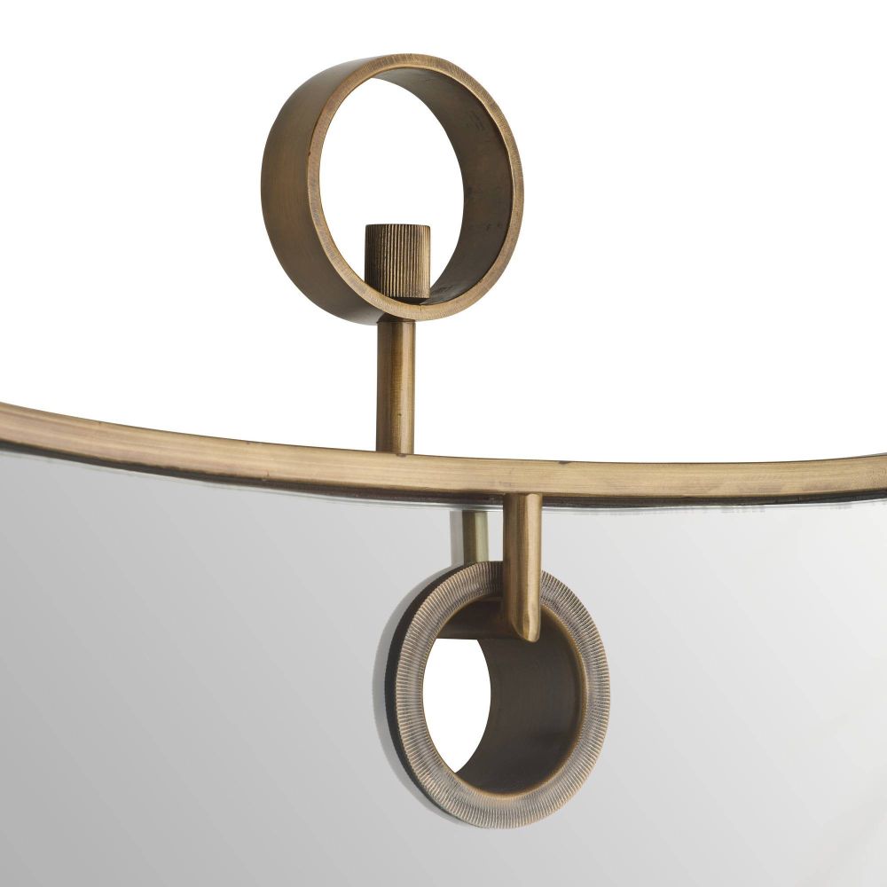 Decorative wall sconce with gold metal design on a white background