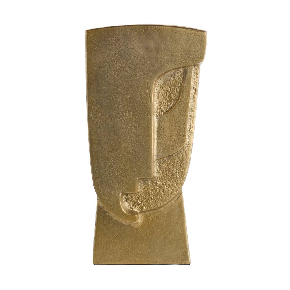 brass sculpture of a face on a white background