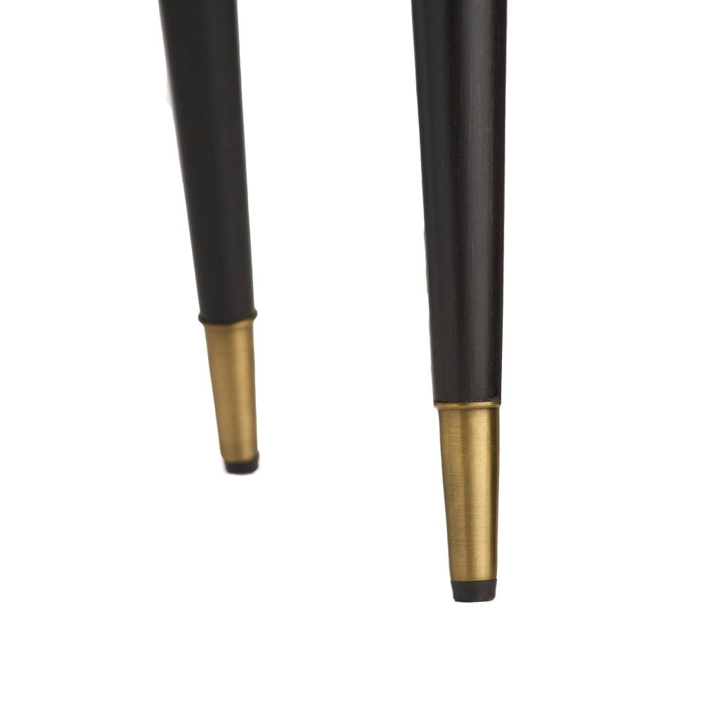 Two black and gold pool cues on a white background