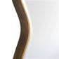 Close-up of a curved bronze metal object on a white background