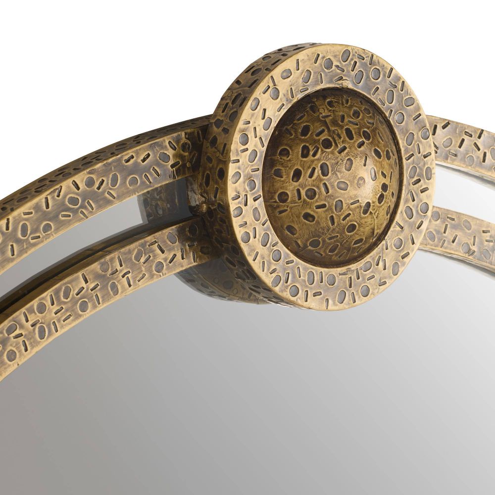 Bronze-colored metal object with intricate design on a gray background